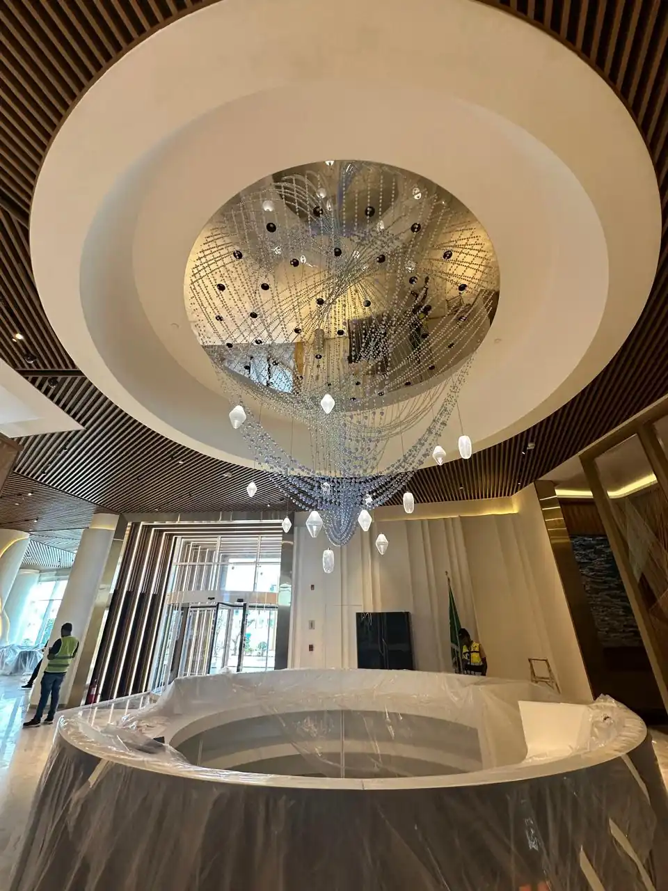 Lobby fit-out with feature ceiling and chandelier